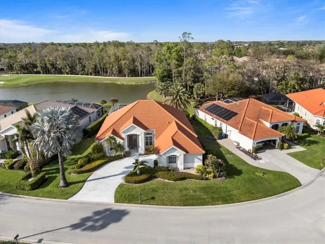 Bird's eye view featuring a water view and a view of trees