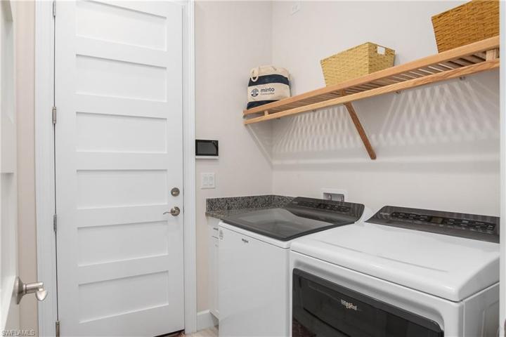Nice Laundry Room with Upgraded Appliances. This door leads to the 2 Car Garage.
