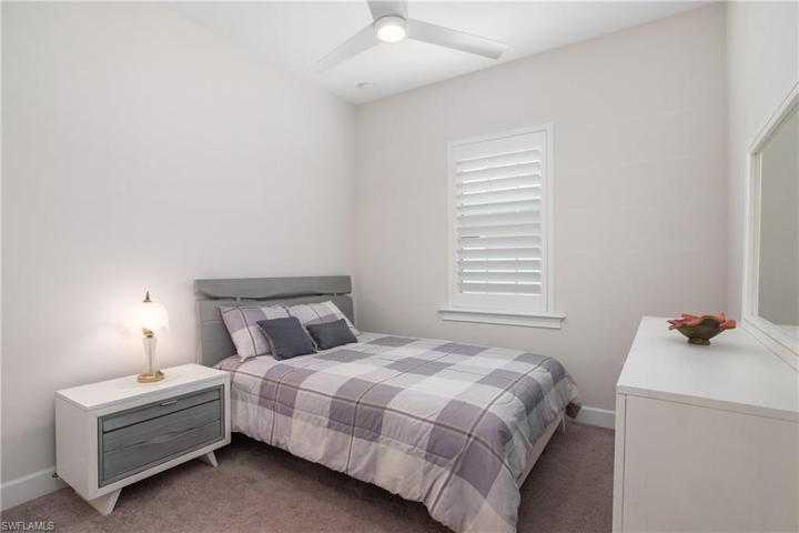 Bedroom 2 of 2, Plantation Shutters, Overhead Fan/Light Fixture. Carpeted Floor.