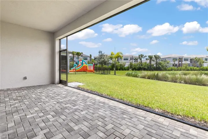 View of patio featuring a playground