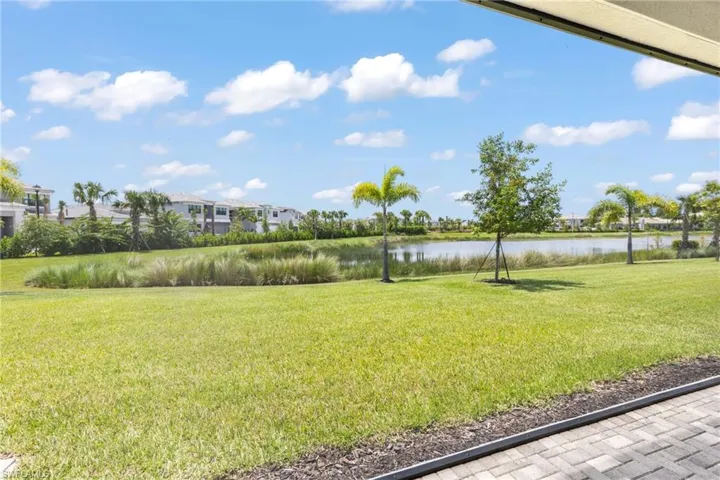 View of yard with a water view
