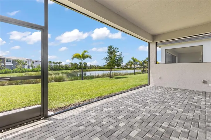 Unfurnished sunroom featuring a water view