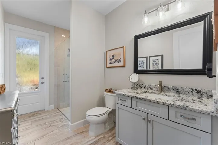 Bath 2 is pool bath; Note the designer glass door insert is hurricane impact.