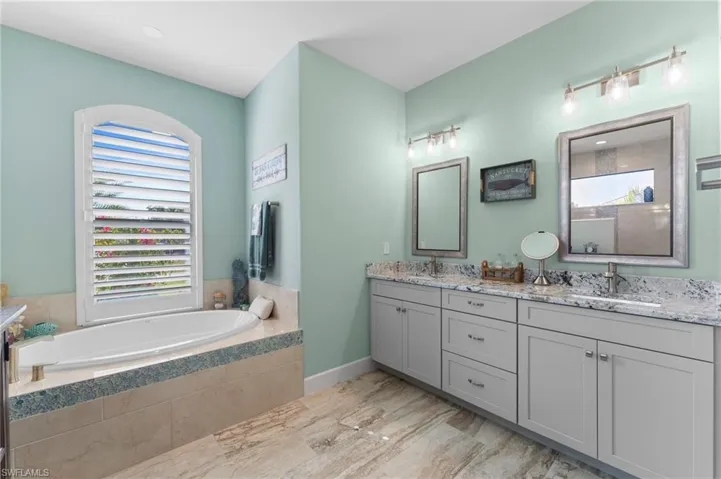 Well-appointed bathroom with lots of cabinets.