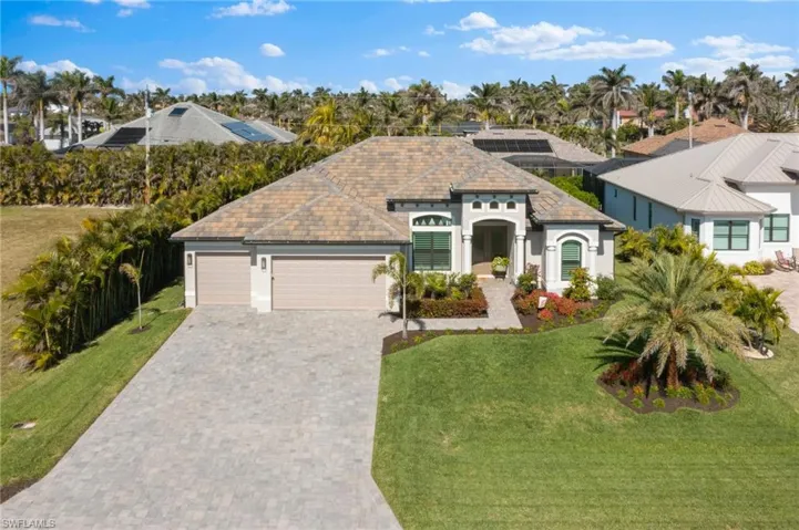 Stunning Front Elevation with lush landscaping.