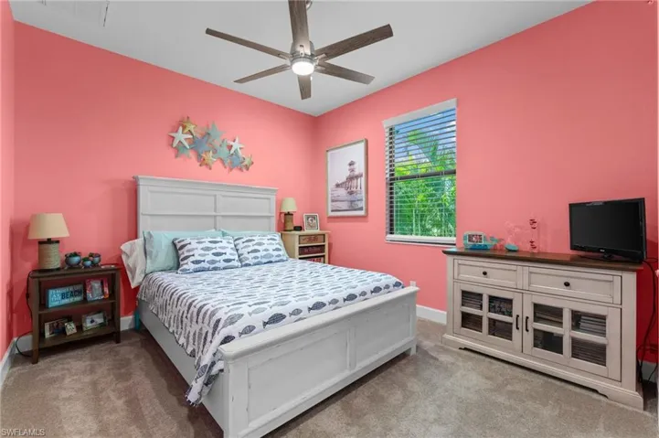 Bedroom featuring carpet and ceiling fan