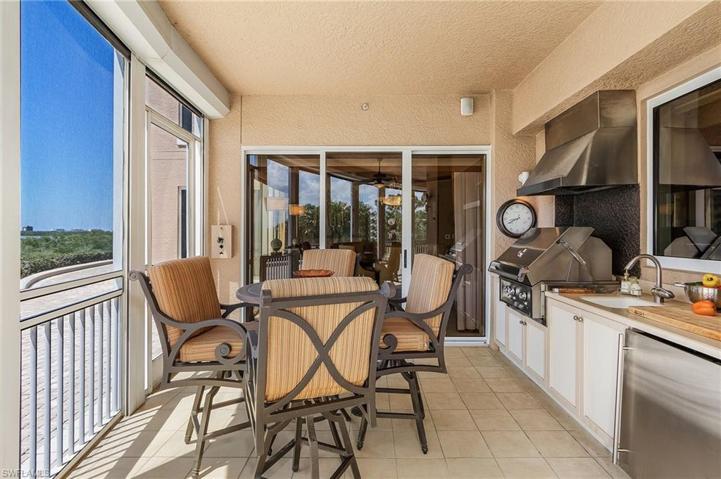 Outdoor kitchen w/grill sink + small refrigerator