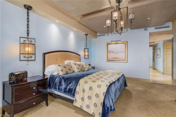 Primary bedroom with tray ceilings