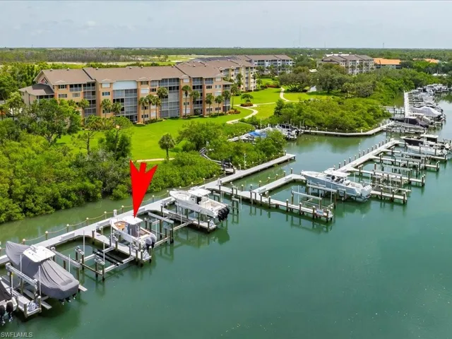Aerial view of a marina and a nearby body of water