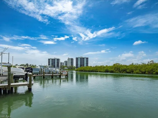 Water view with a dock and boat lift