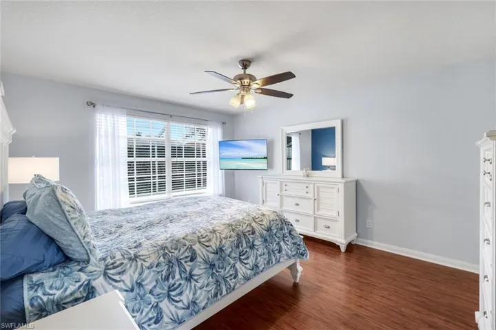 Bedroom featuring dark wood finished floors and ceiling fan