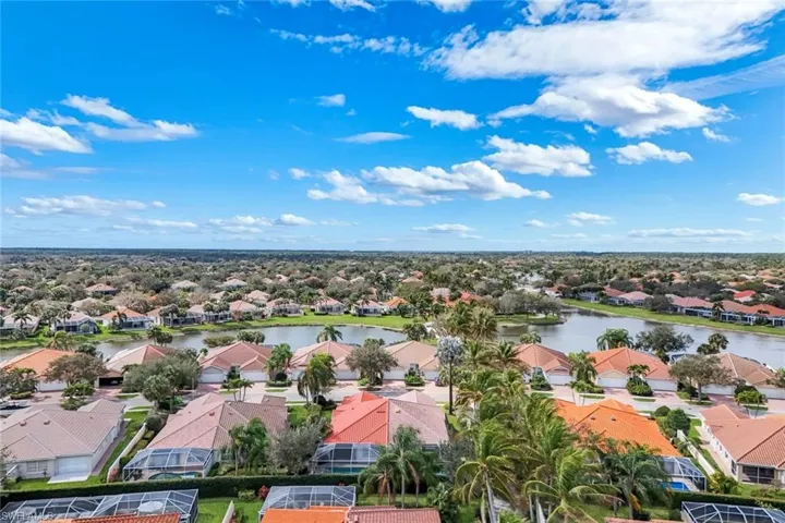 Aerial view of residential area featuring a large body of water