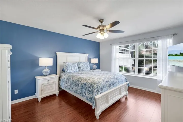 Bedroom featuring dark wood finished floors and ceiling fan