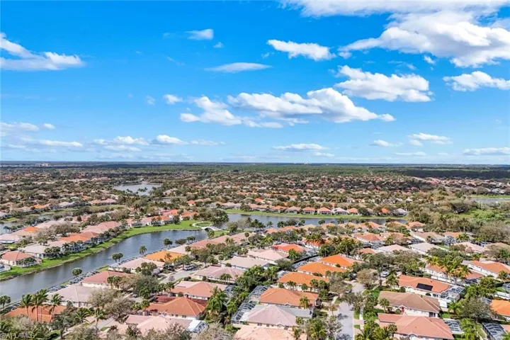 Aerial perspective of suburban area with a nearby body of water