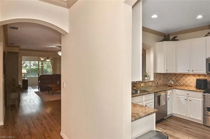 View from the hallway into the kitchen and living room
