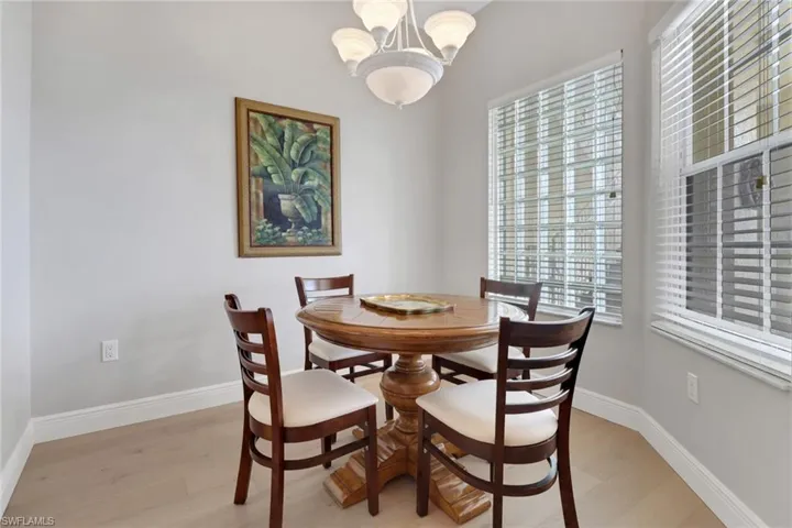 Dining area with a chandelier and light wood finished floors