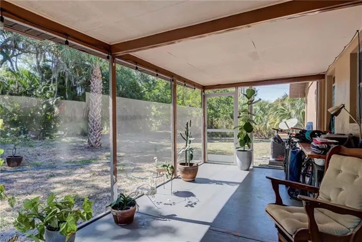 Sunroom featuring concrete floors and floor to ceiling windows