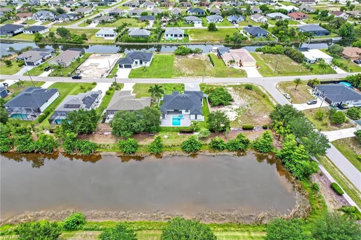 Aerial perspective showcasing a residential community with waterways