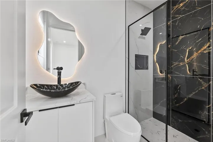 Contemporary bathroom featuring a black and white color palette