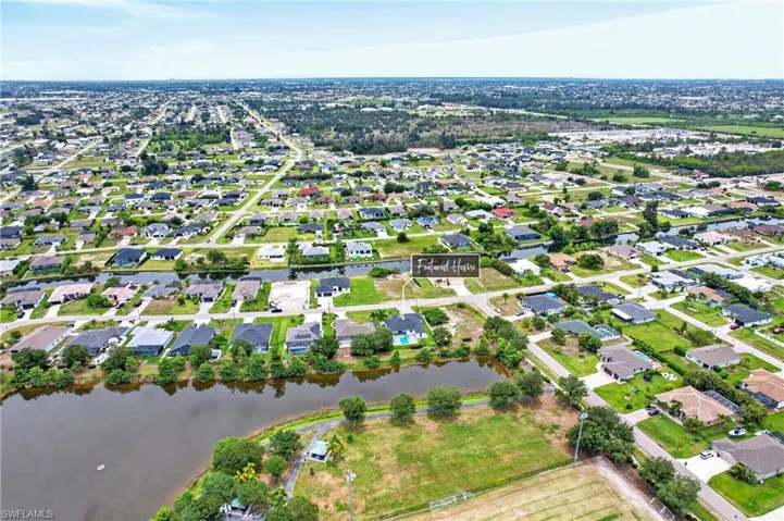 Aerial perspective highlighting a residential community with canals and waterways