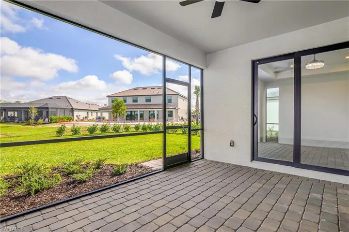 Enjoy indoor/outdoor living with large screened-in lanai. Note the privacy Clusia on the perimeter of the property.
