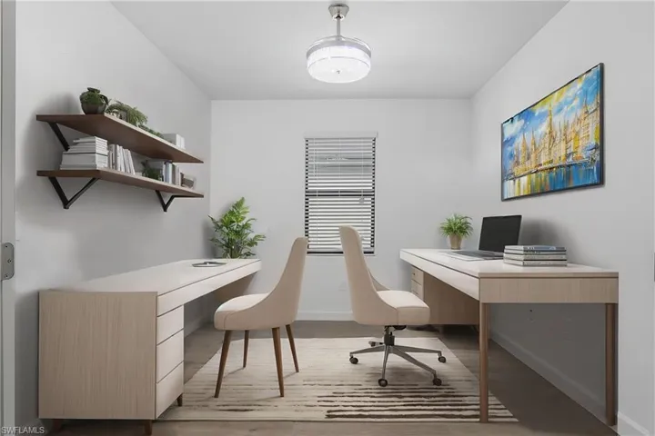 Versatile Den with double french doors is perfect for a home office or additional TV room. (Furniture digitally added.)