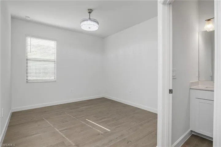 Spacious guest bedroom includes chandelier/ceiling fan, and has its own ensuite bathroom. (furniture digitally added)