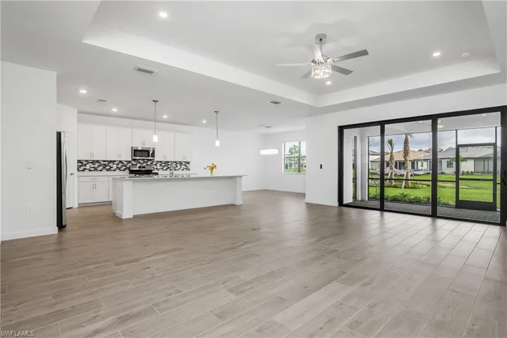 Enjoy seamless indoor/outdoor living with open great room featuring impact sliders, and large lanai.