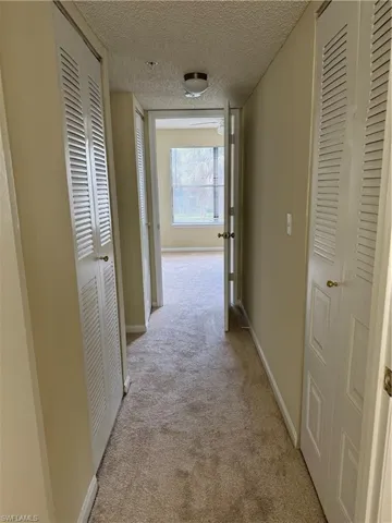 Corridor with hall closet access