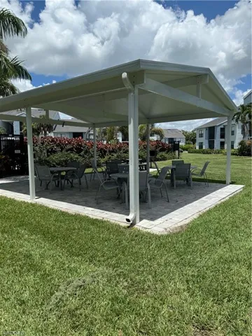 View of community with a lawn and a patio area