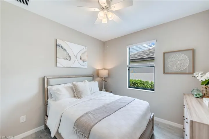 Bedroom featuring ceiling fan and light hardwood / wood-style floors
