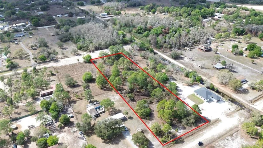 Aerial view of property and surrounding area with property boundaries highlighted