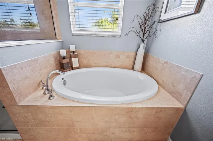 Bathroom featuring a relaxing tiled tub