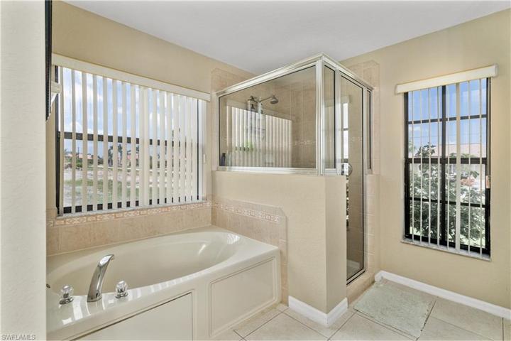 Primary bath has tub and shower