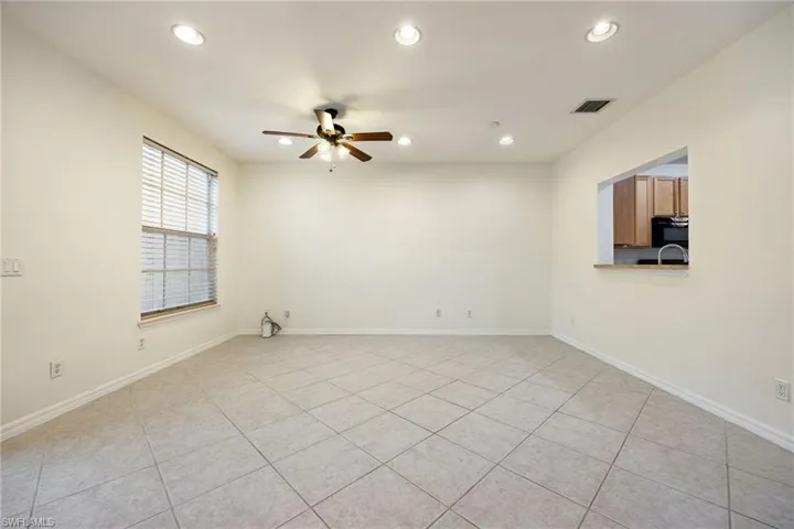 Living room with window to the kitchen