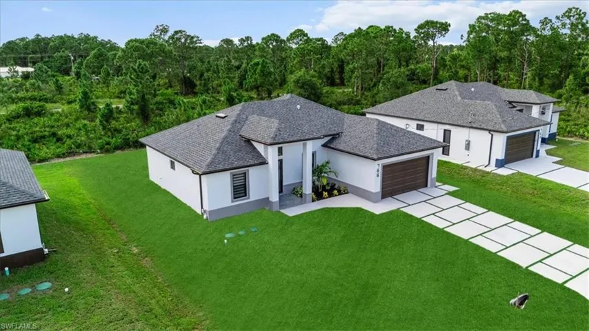 View from above of property featuring a forest