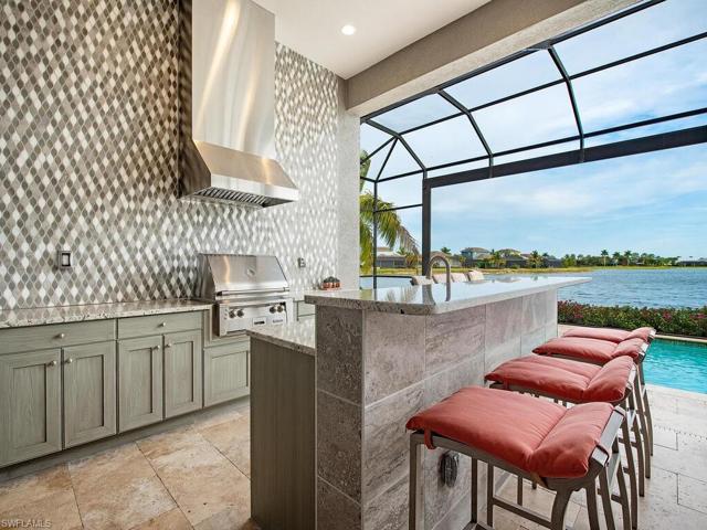 Outdoor bar -gas grill -kitchen and storage area complete with beautiful panoramic water view