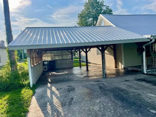 View of vehicle parking with a carport