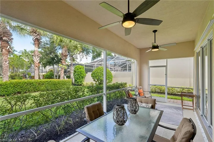 Sunroom / solarium featuring ceiling fan, plenty of natural light, and outdoor dining area