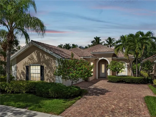 Mediterranean / spanish house featuring stucco siding, decorative driveway, and a tiled roof