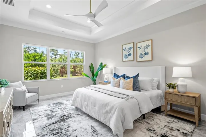 Primary Bedroom featuring enough room for sitting area, overlooking beautiful Southern preserve view