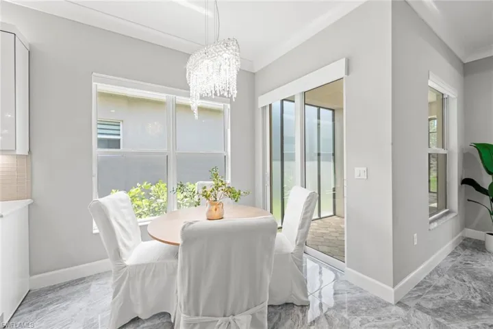 Breakfast nook featuring stunning chandelier