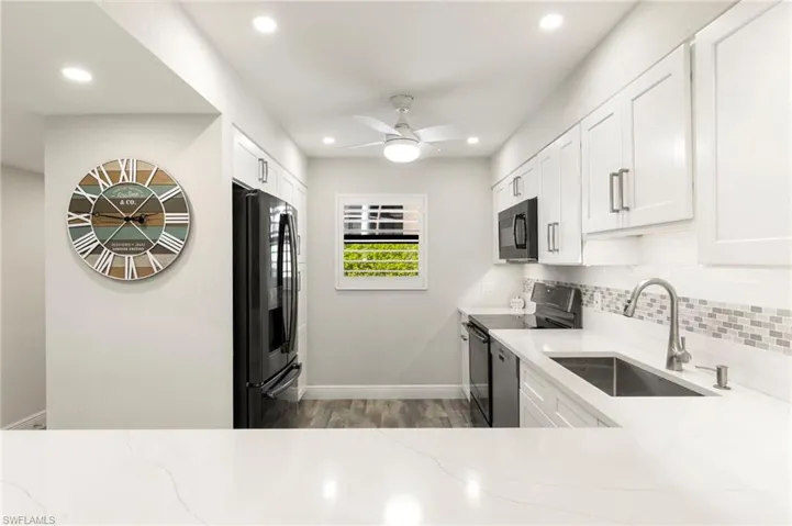 Crisp updated cabinetry and quartz counter tops