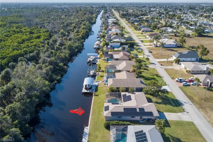 Aerial perspective of suburban area with a large body of water