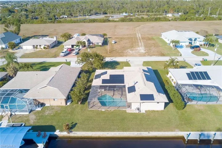 Aerial view of residential area featuring a pool area