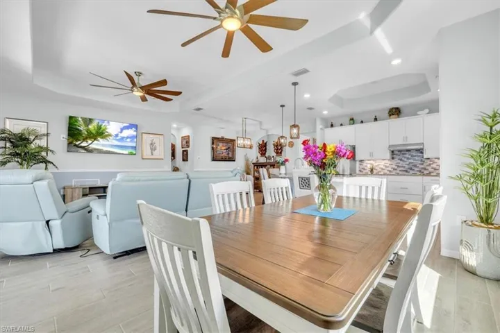 Tray ceilings with integrated lighting and multiple ceiling fans