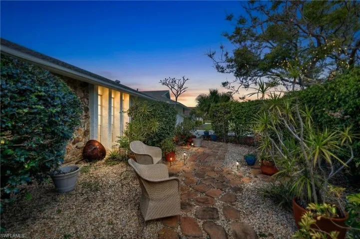 Front of house in secret garden area.