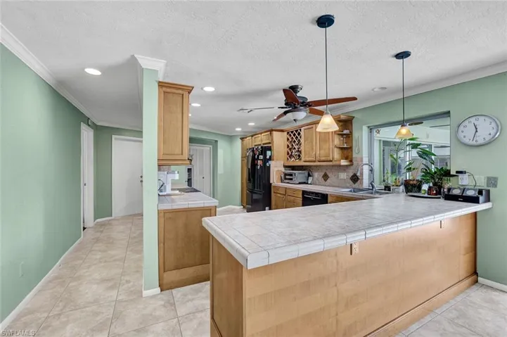 Kitchen with view from den