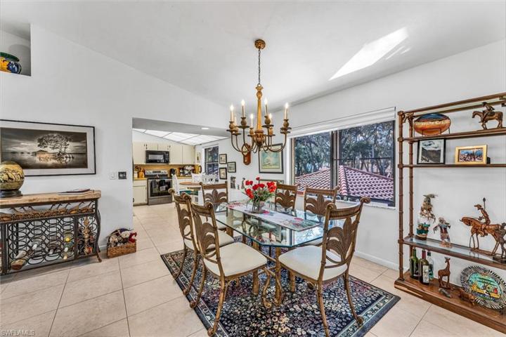 Dining area. Excluded from sale is the area carpet and the iron wine rack. Lists of exclusions will be added.