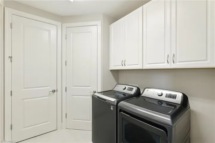 Clothes washing area with cabinet space and independent washer and dryer